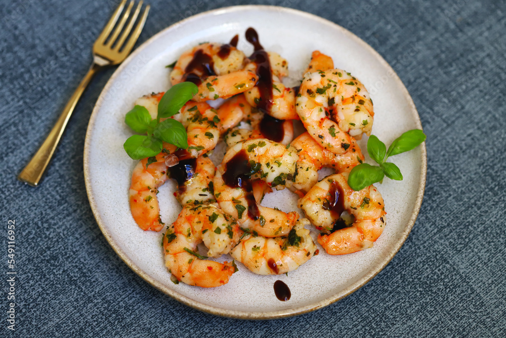 Asian style cooked shrimp with hot spices on a plate. Asian style cooked shrimp with hot spices on a plate.