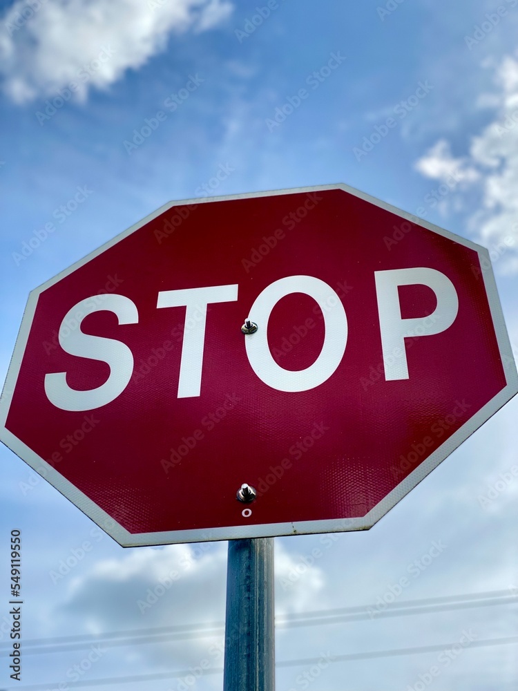 stop sign on blue sky background city 
