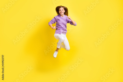 Full length photo of active energetic lady wear violet trendy outfit hurry black friday sale shopping isolated on yellow color background
