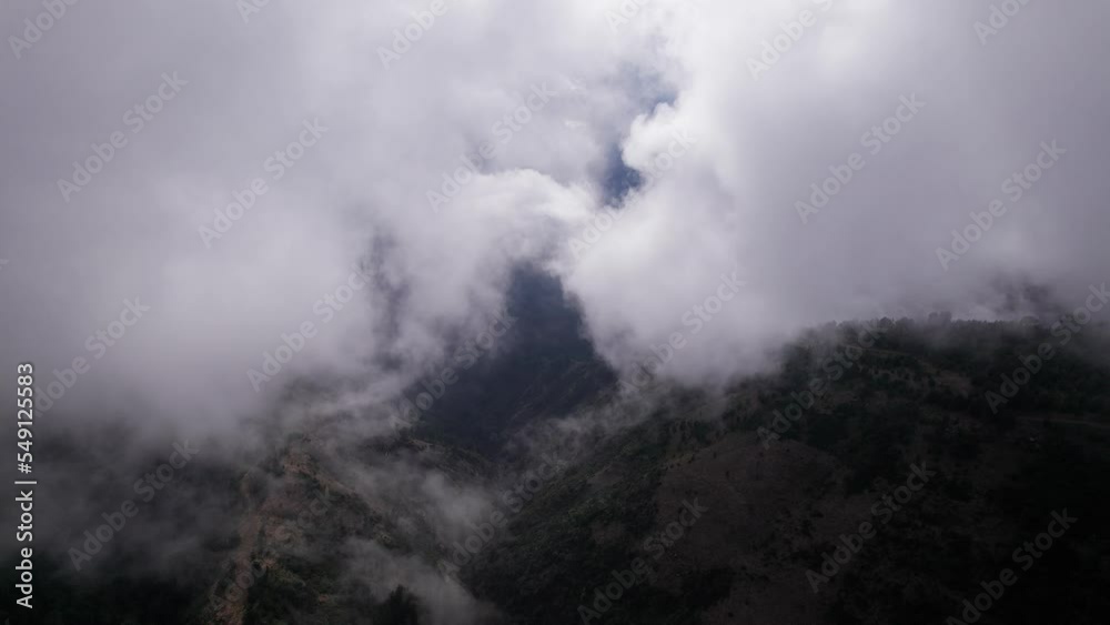 Drone flying above the clouds in the mountains with beautiful sun on the island of madeira in Portugal Drone flying above the clouds in the mountains with beautiful sun on the island of madeira in Portugal