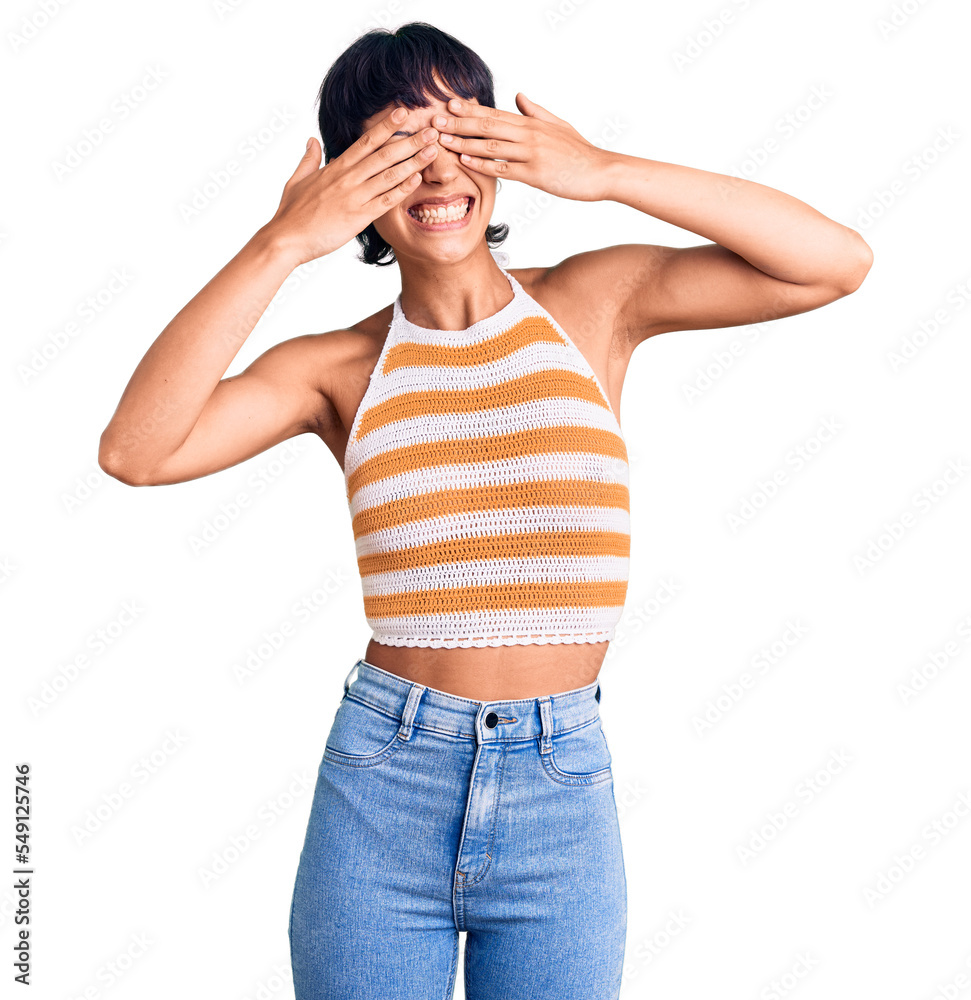 Young brunette woman with short hair wearing casual clothes covering eyes with hands smiling cheerful and funny. blind concept. Young brunette woman with short hair wearing casual clothes covering eyes with hands smiling cheerful and funny. blind concept.