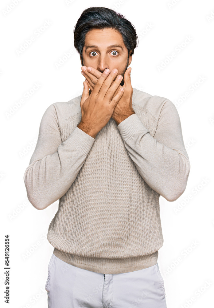 Young hispanic man wearing casual clothes shocked covering mouth with hands for mistake. secret concept. Young hispanic man wearing casual clothes shocked covering mouth with hands for mistake. secret concept.