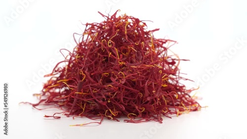 Heap of Moroccan saffron rotating on white background. 