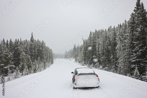 Electric car driving, mountains snow, National Park