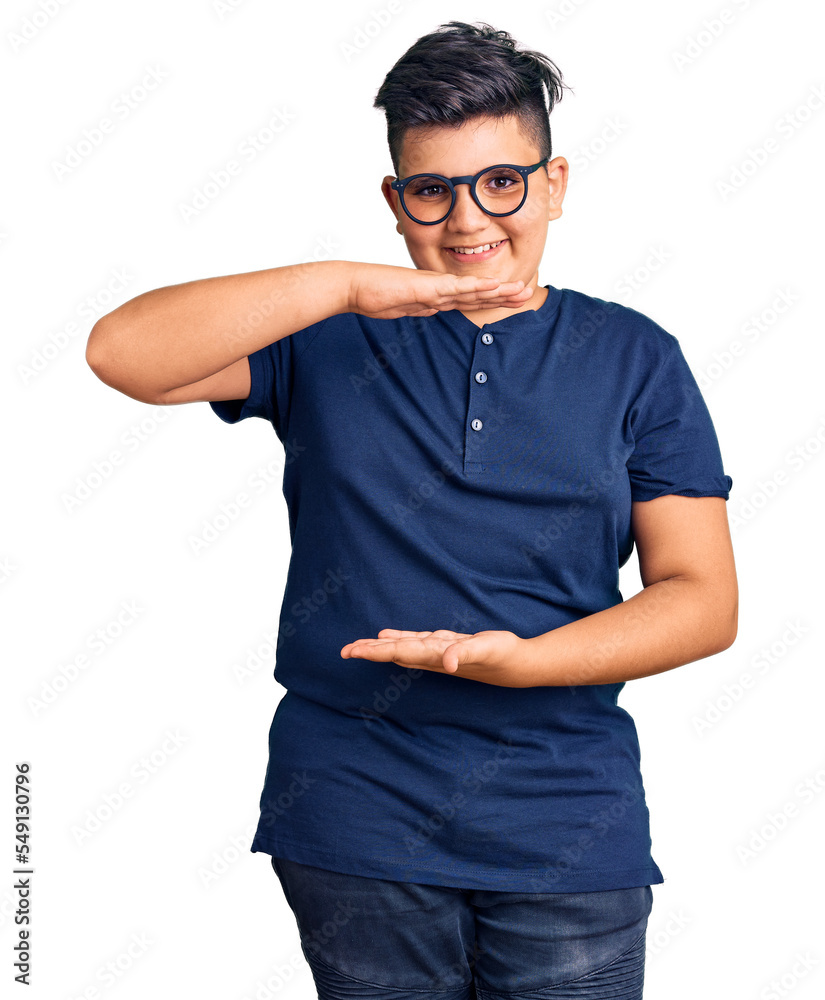 Little boy kid wearing casual clothes and glasses gesturing with hands showing big and large size sign, measure symbol. smiling looking at the camera. measuring concept. Little boy kid wearing casual clothes and glasses gesturing with hands showing big and large size sign, measure symbol. smiling looking at the camera. measuring concept.
