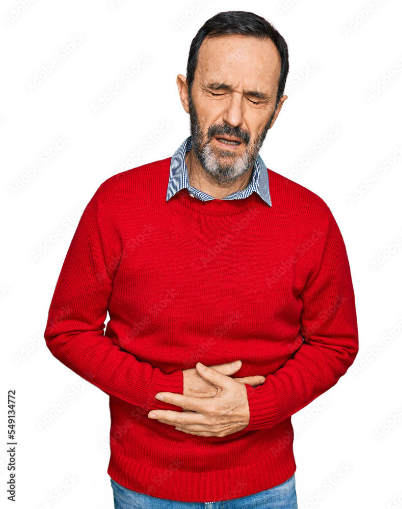 Middle age hispanic man wearing casual clothes with hand on stomach because indigestion, painful illness feeling unwell. ache concept. Middle age hispanic man wearing casual clothes with hand on stomach because indigestion, painful illness feeling unwell. ache concept.
