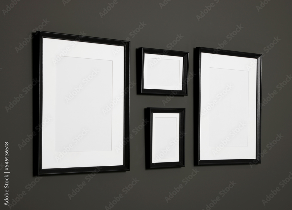 Empty frames on black wall. Mockup for design Empty frames on black wall. Mockup for design