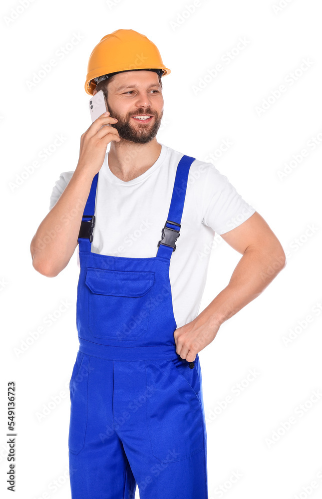 Professional repairman in uniform talking on smartphone against white background Professional repairman in uniform talking on smartphone against white background