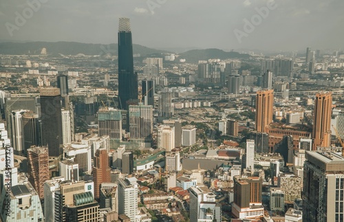 Scenic view of the skyline of Bukit Bintang from KL Tower Menara on a gloomy day in Kuala Lumpur photo