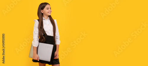 Fotografie, Obraz happy child in school uniform hold computer, education
