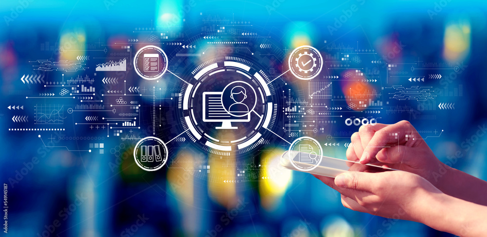 Document management system concept with person using a smartphone in a city at night Document management system concept with person using a smartphone in a city at night