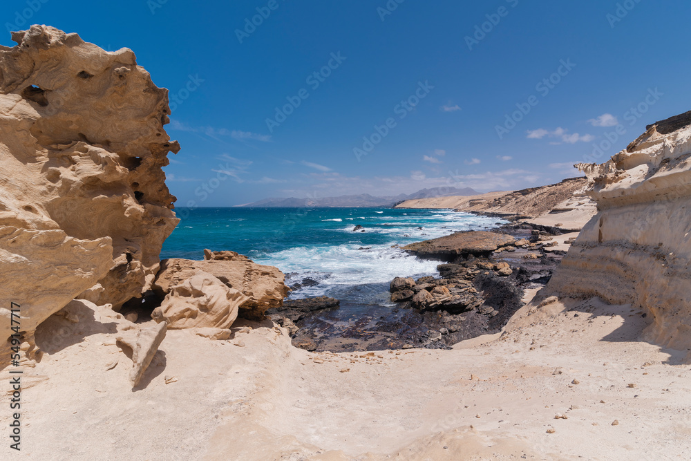 Panorama view with wide white desert rocky coastline plateau and turquoise blue ocean, Canary Islands