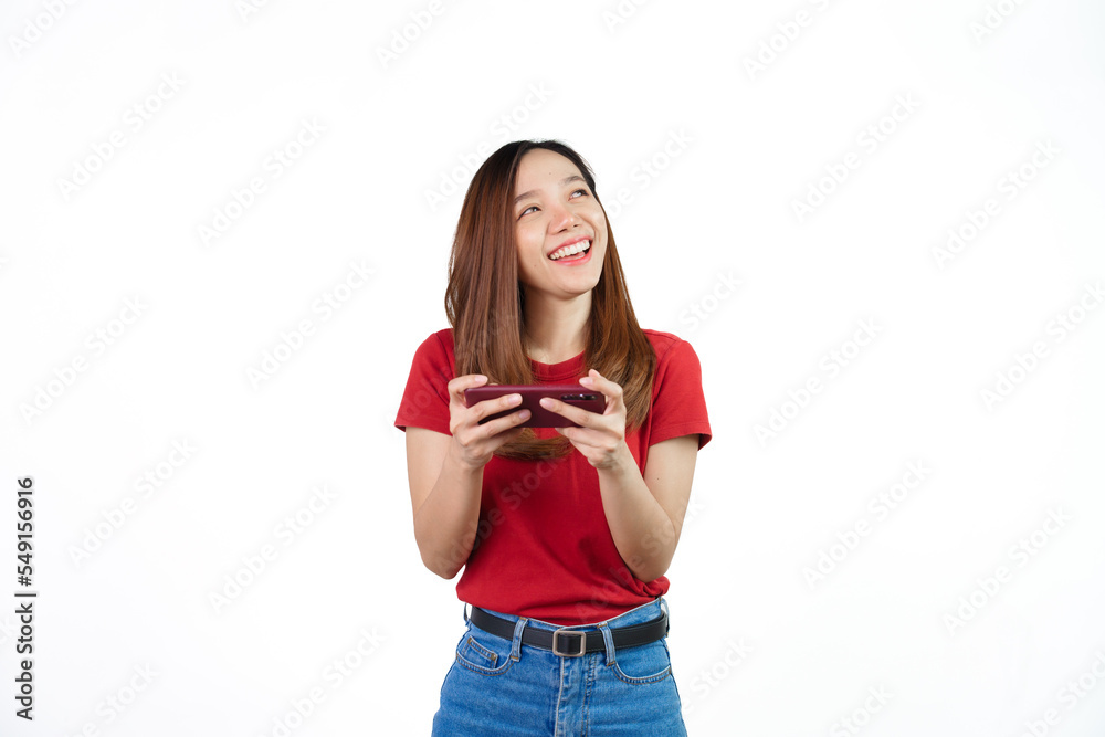 Playing mobile games , Pretty Asian people wearing red t-shirt for a woman isolated on white background. Playing mobile games , Pretty Asian people wearing red t-shirt for a woman isolated on white background.