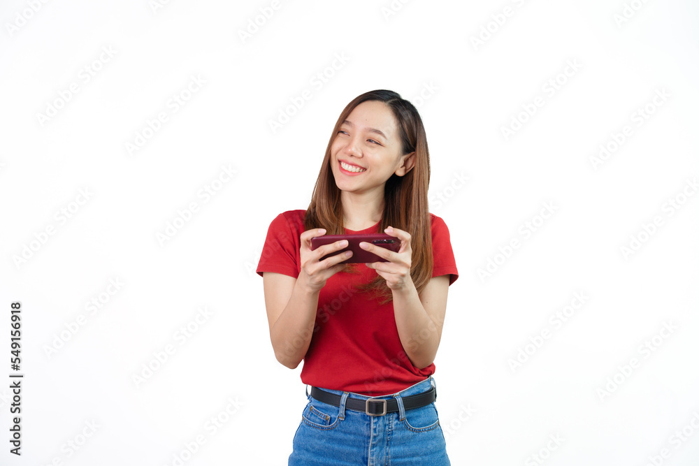 Playing mobile games , Pretty Asian people wearing red t-shirt for a woman isolated on white background. Playing mobile games , Pretty Asian people wearing red t-shirt for a woman isolated on white background.