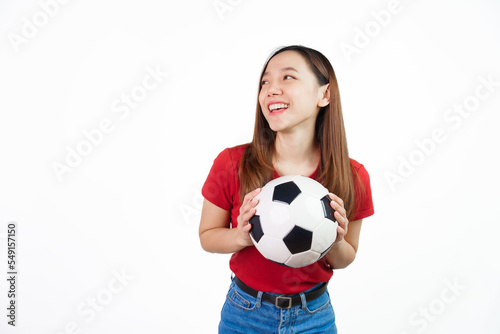 Holding football, Pretty asian women England soccer fans celebrating over white background isolated. Sports fan isolated young woman. © makibestphoto