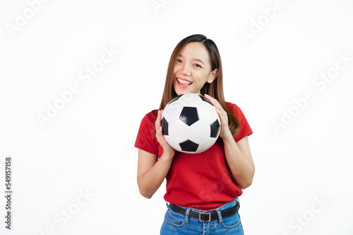 Holding football, Pretty asian women England soccer fans celebrating over white background isolated. Sports fan isolated young woman. © makibestphoto
