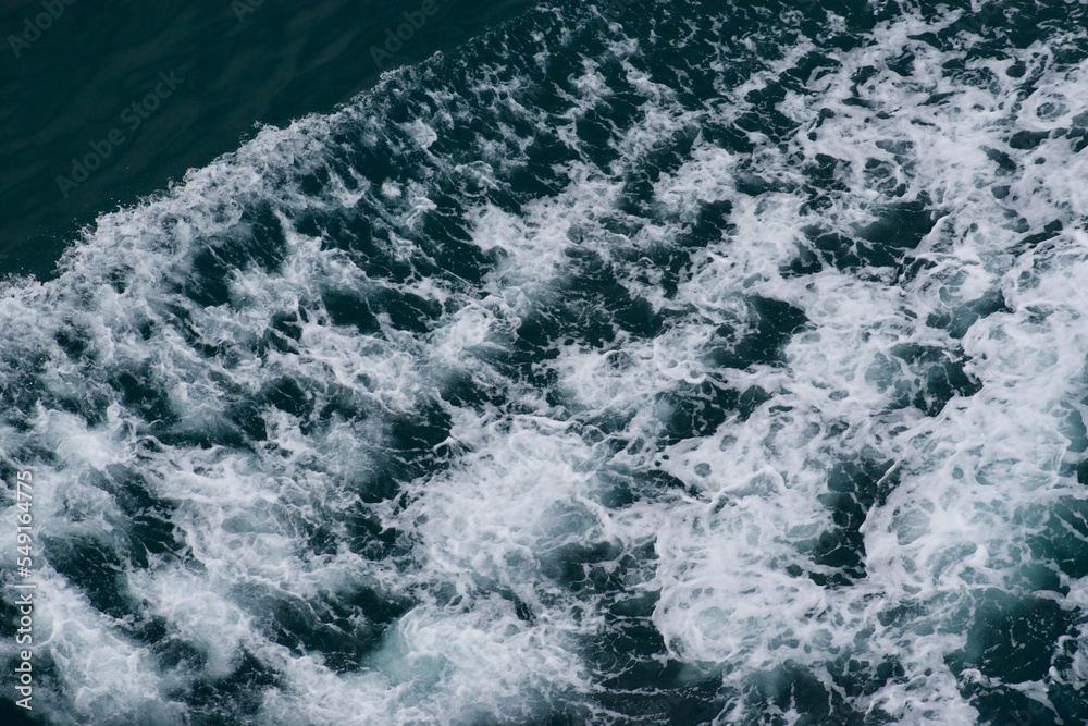 waves in the water from a wake
