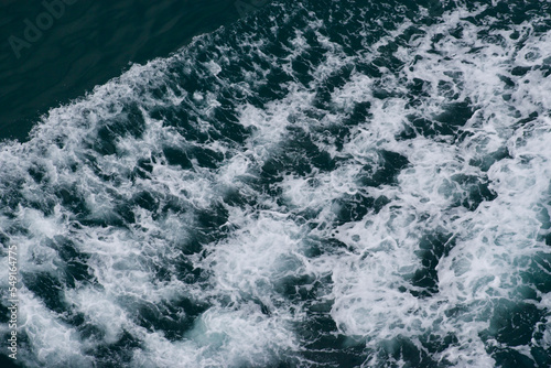 waves in the water from a wake