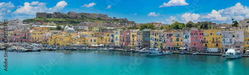 Fotografia Italy, Procida Island shoreline with shops and colorful old city buildings facin