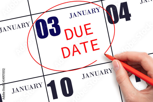Hand writing text DUE DATE on calendar date January 3 and circling it. Payment due date