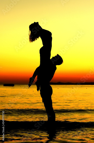 silhouette of person jumping on the beach