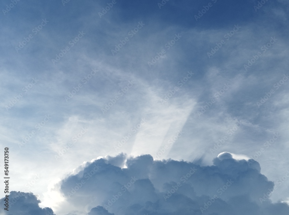 Amazing Clouds at sunset with beautiful silver lining and a thick ray of sun light coming out from behind one of the silver lining clouds. Amazing Clouds at sunset with beautiful silver lining and a thick ray of sun light coming out from behind one of the silver lining clouds.