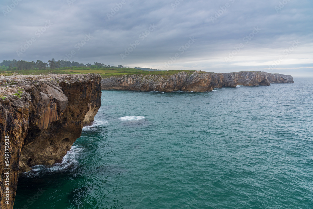 Cliffs of the Bufones de Pria, Asturias, where the water seeps through the rock to create the natural phenomenon.