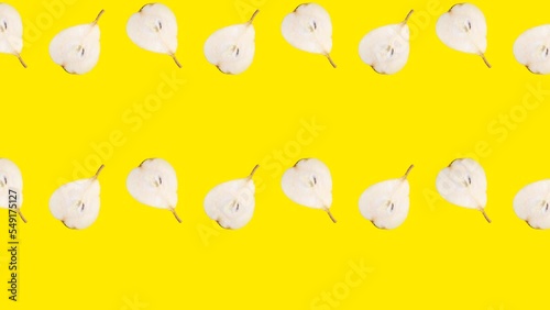 Pear slices in seamless loop pattern on a yellow background. Exotic fruits in seamless loop animation. Endless food motion graphic background (ID: 549175127)