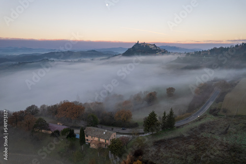 Fototapeta Naklejka Na Ścianę i Meble -  Aerial view of foggy morning in Marche region in Italy