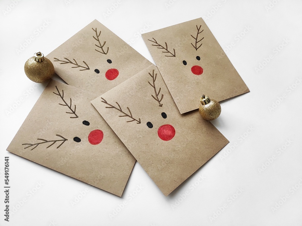 Christmas kraft envelopes with funny deer, idea for decorating gifts for Christmas and Advent calendar, copy space Christmas kraft envelopes with funny deer, idea for decorating gifts for Christmas and Advent calendar, copy space