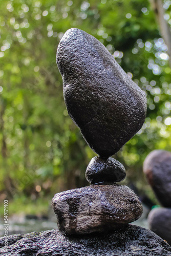 Stone tower on the beach and blur background. Pebble tower on the river. Balancing Rocks. 