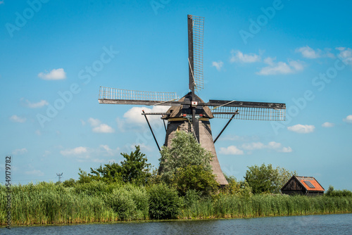 Traditional Dutch windmill on one of the existing canals in the Netherlands.
