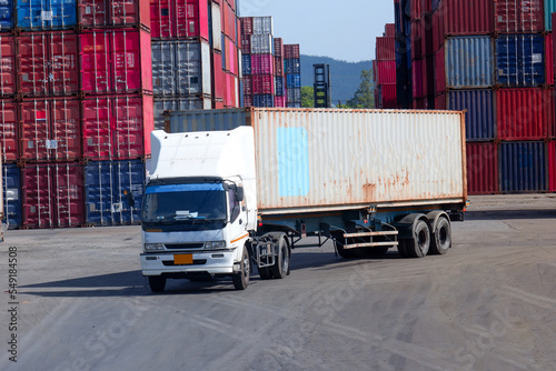 Trucks in a container warehouse, view of transportation