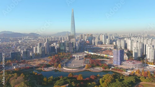 Seoul: Aerial view of capital city of South Korea, Olympic Park, skyline with modern high-rise buildings and Lotte World Tower in autumn, clear blue sky - landscape panorama of East Asia from above