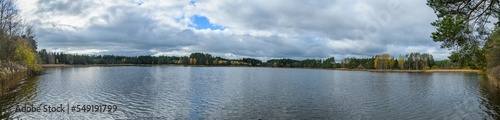 panorama landscape with pond and clouds in autumn