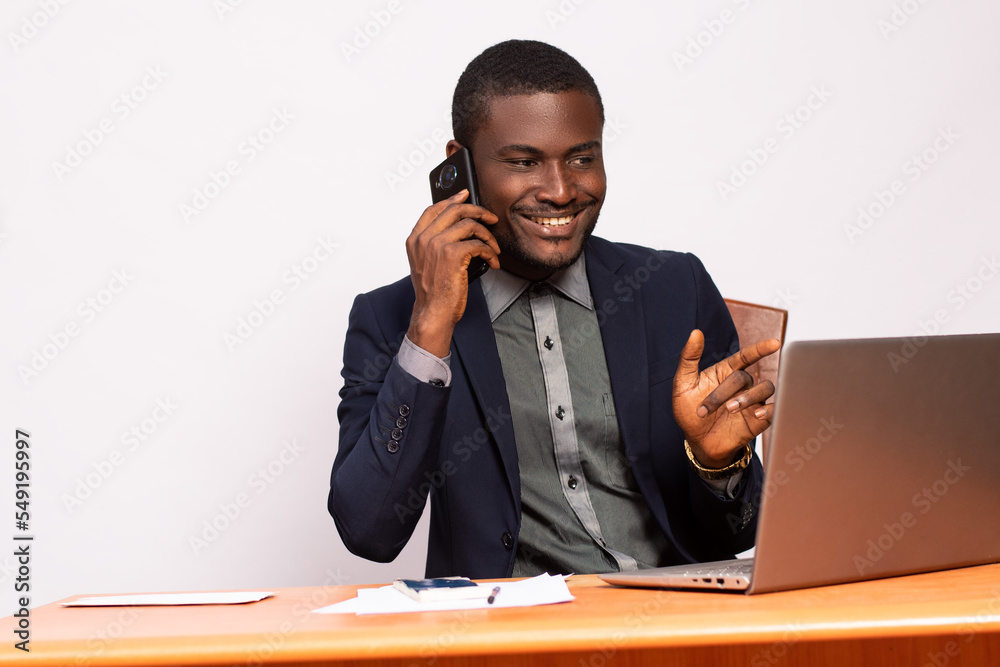 business man making a phone call while working business man making a phone call while working