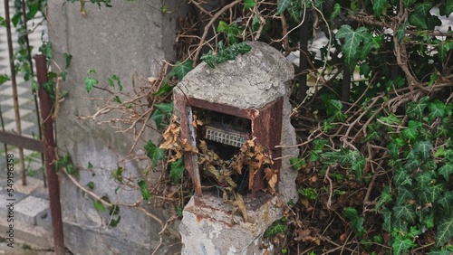 Devastated Outdoor Electric Box Pole With Exposed Cables Posing Shock Danger