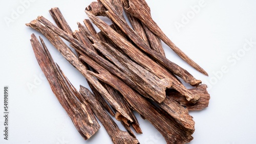 Closeup of agarwood sticks on white background photo