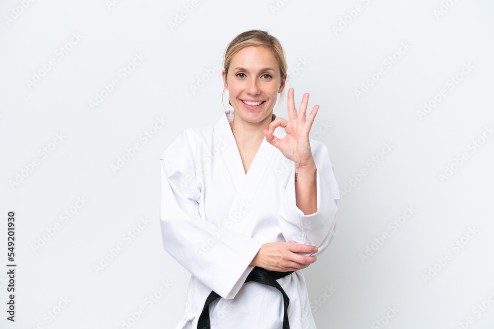 Young caucasian woman isolated on white background showing ok sign with fingers Young caucasian woman isolated on white background showing ok sign with fingers