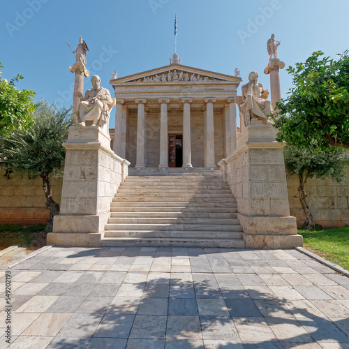 The national academy's main facade with Socrates, Plato, Athena and Apollo marble statues. Culture travel in Athens, Greece.