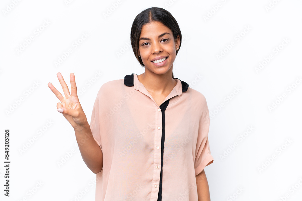 Young African american woman isolated on white background happy and counting three with fingers Young African american woman isolated on white background happy and counting three with fingers