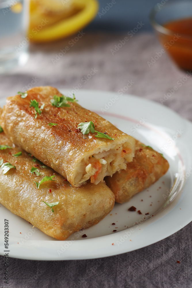 Spring rolls - a typical dish in Chinese and other Southeast Asian cuisines Spring rolls - a typical dish in Chinese and other Southeast Asian cuisines