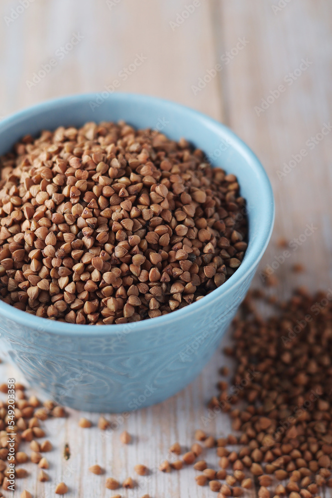 Buckwheat grain in a small ceramic bowl Buckwheat grain in a small ceramic bowl