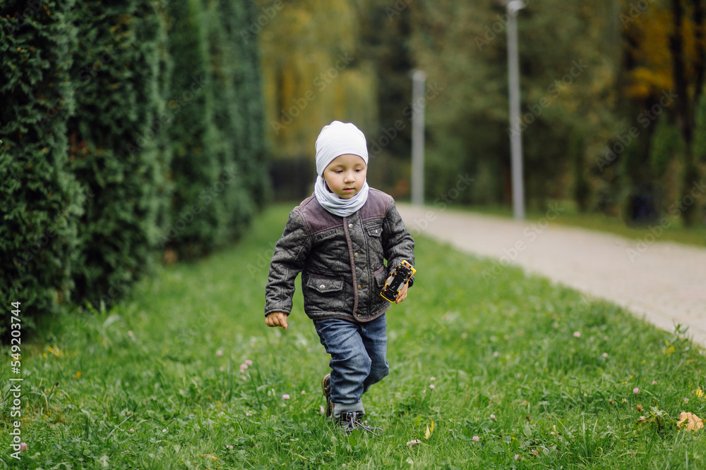 Mom and son walking and having fun together in the autumn park. Mom and son walking and having fun together in the autumn park.