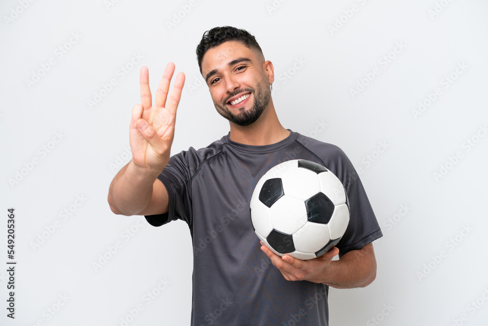 Arab young football player man isolated on white background happy and counting three with fingers Arab young football player man isolated on white background happy and counting three with fingers
