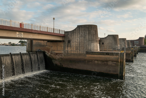 Dam (weir) of a hydro power plant along Weser river (Bremen). Water cascading down a barrage.  Weir called 