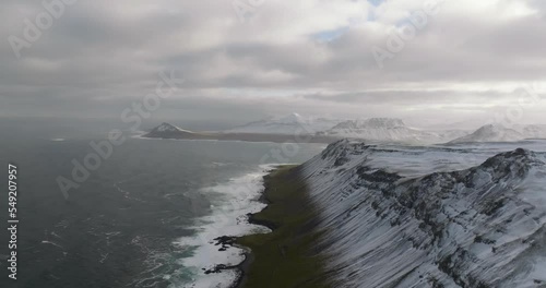 Wallpaper Mural scenic icelandic landscape view on rocky shore ocean, snowy mountains and green grass Torontodigital.ca