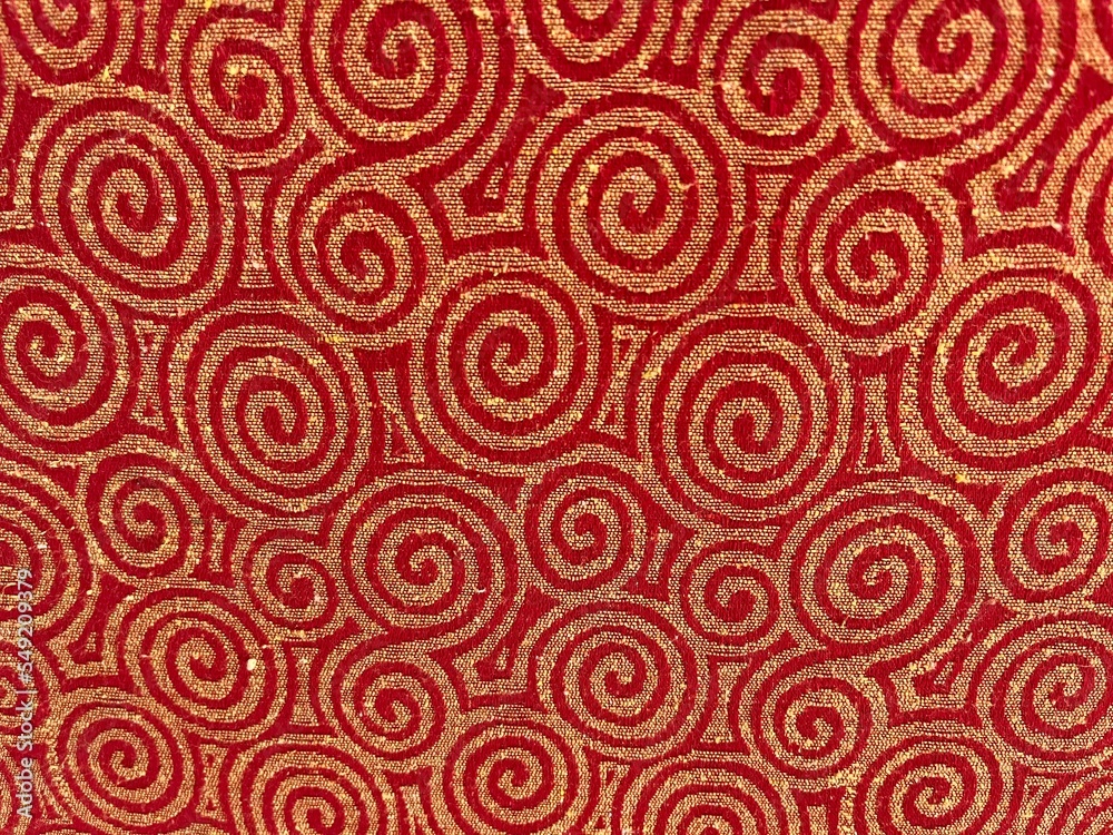 Background of swirl pattern on a chair in red and golden color. Background of swirl pattern on a chair in red and golden color.