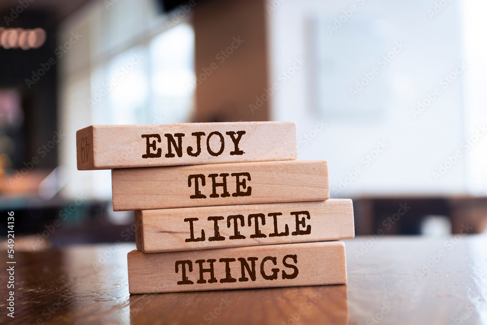 Wooden blocks with words 'Enjoy the little things'. Wooden blocks with words 'Enjoy the little things'.