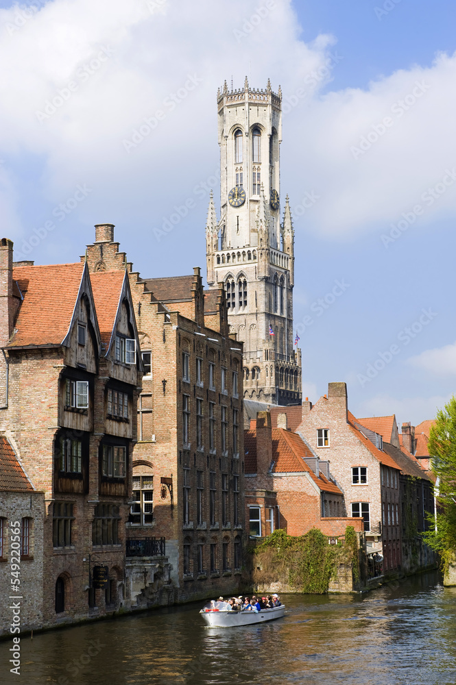 Famous canal of Rozenhoedkaai and the Belfry in the background, Bruges, Belgium